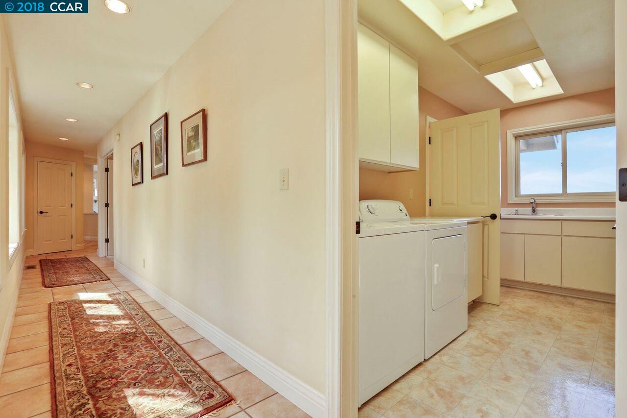 300 Eagle Drive Murphys, CA 95247 - Photo 27 of 40 a view of a hallway with white cabinets