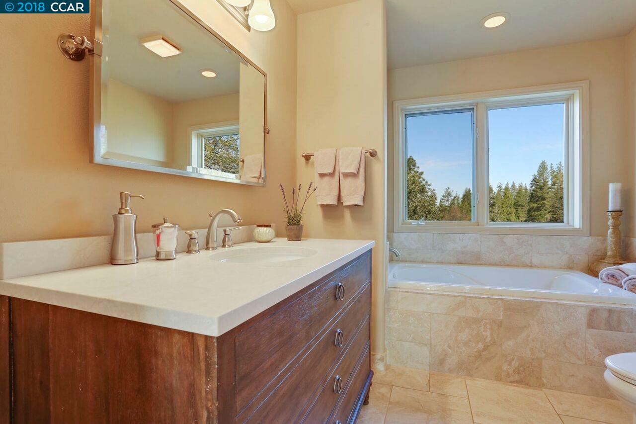 300 Eagle Drive Murphys, CA 95247 - Photo 29 of 40 a bathroom with a sink vanity and a mirror