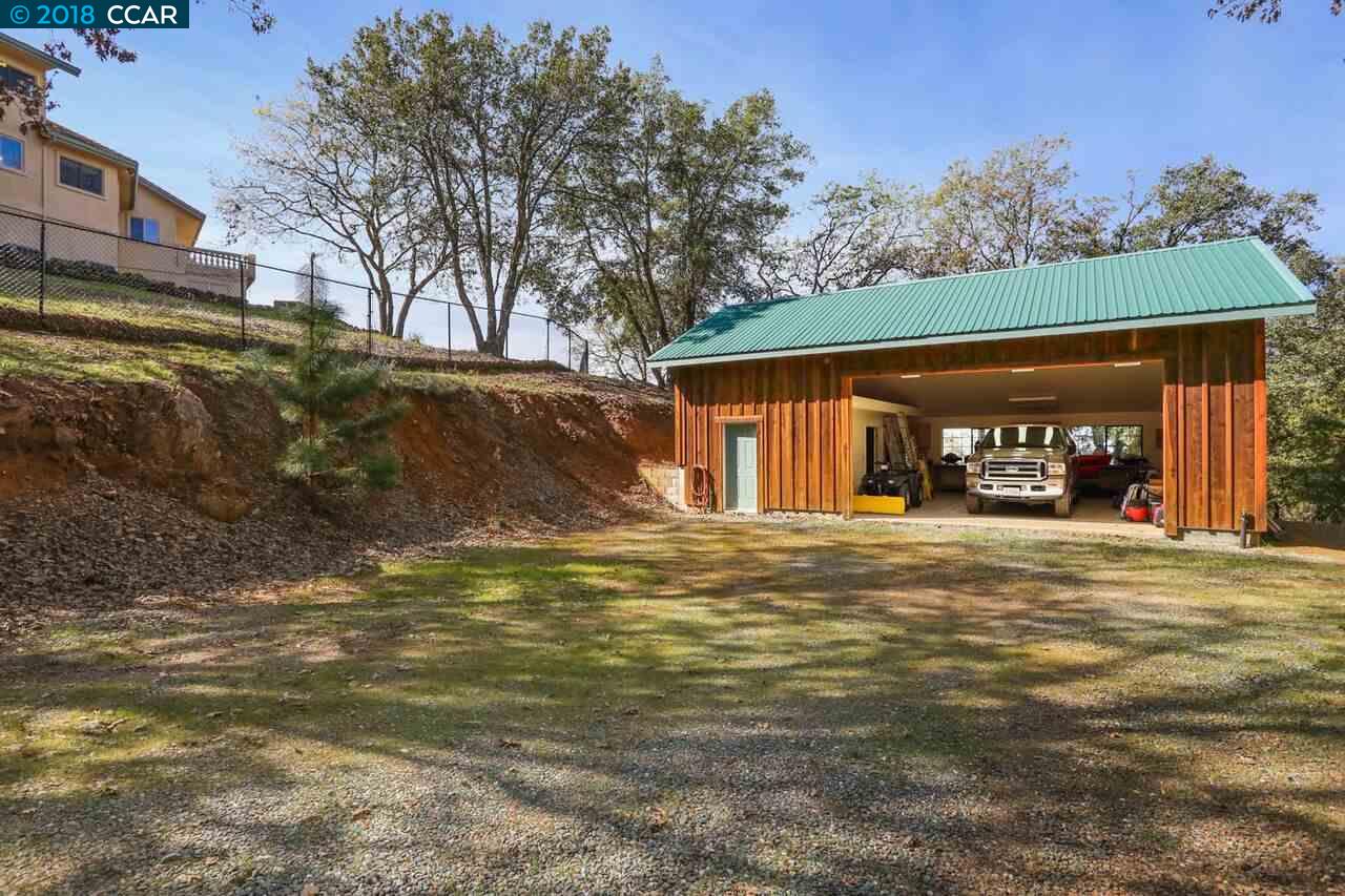 300 Eagle Drive Murphys, CA 95247 - Photo 38 of 40 a view of a house with a yard and garage