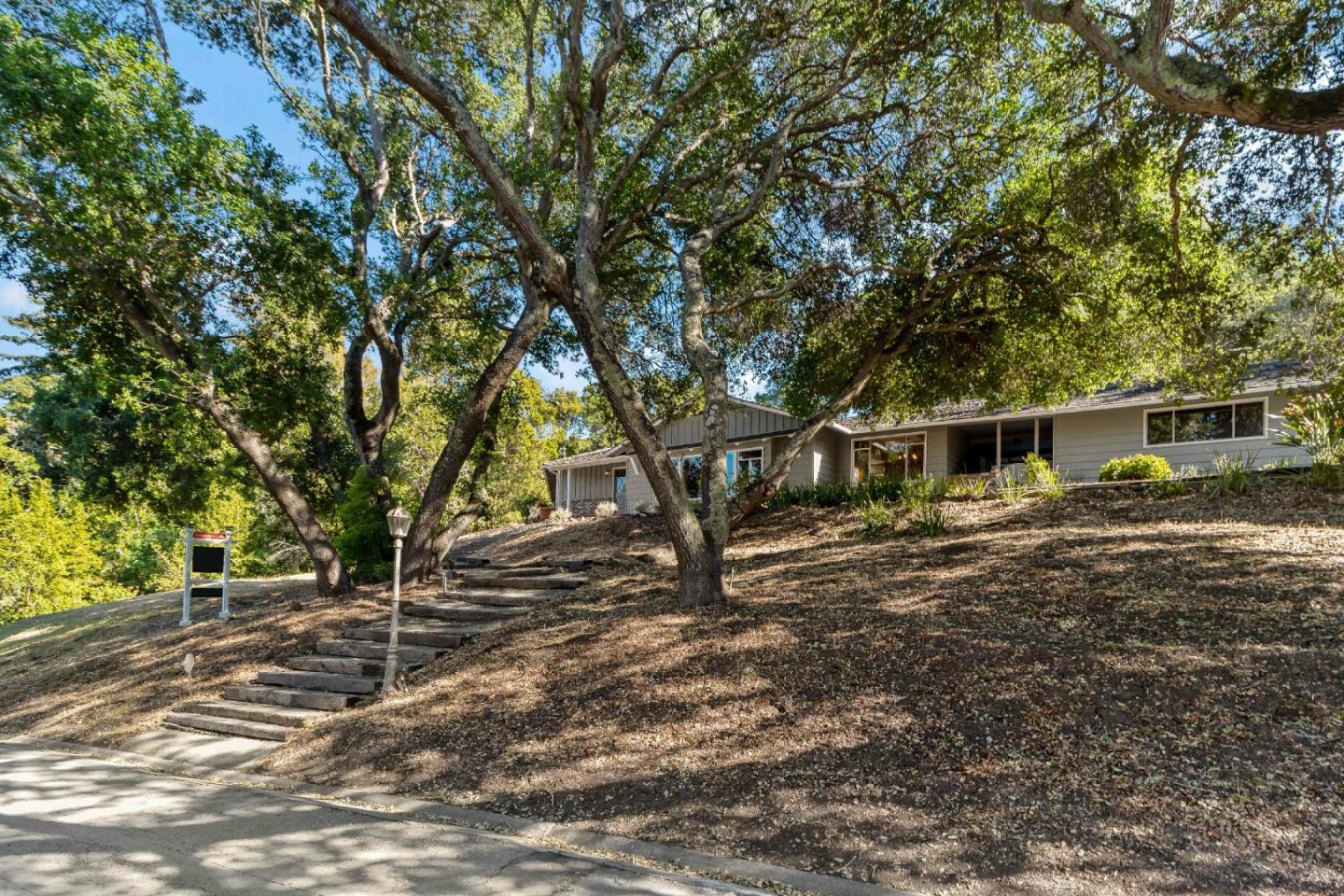 335 Harcross Road Woodside, CA 94062 - Photo 1 of 72 a backyard of a house with table and chairs