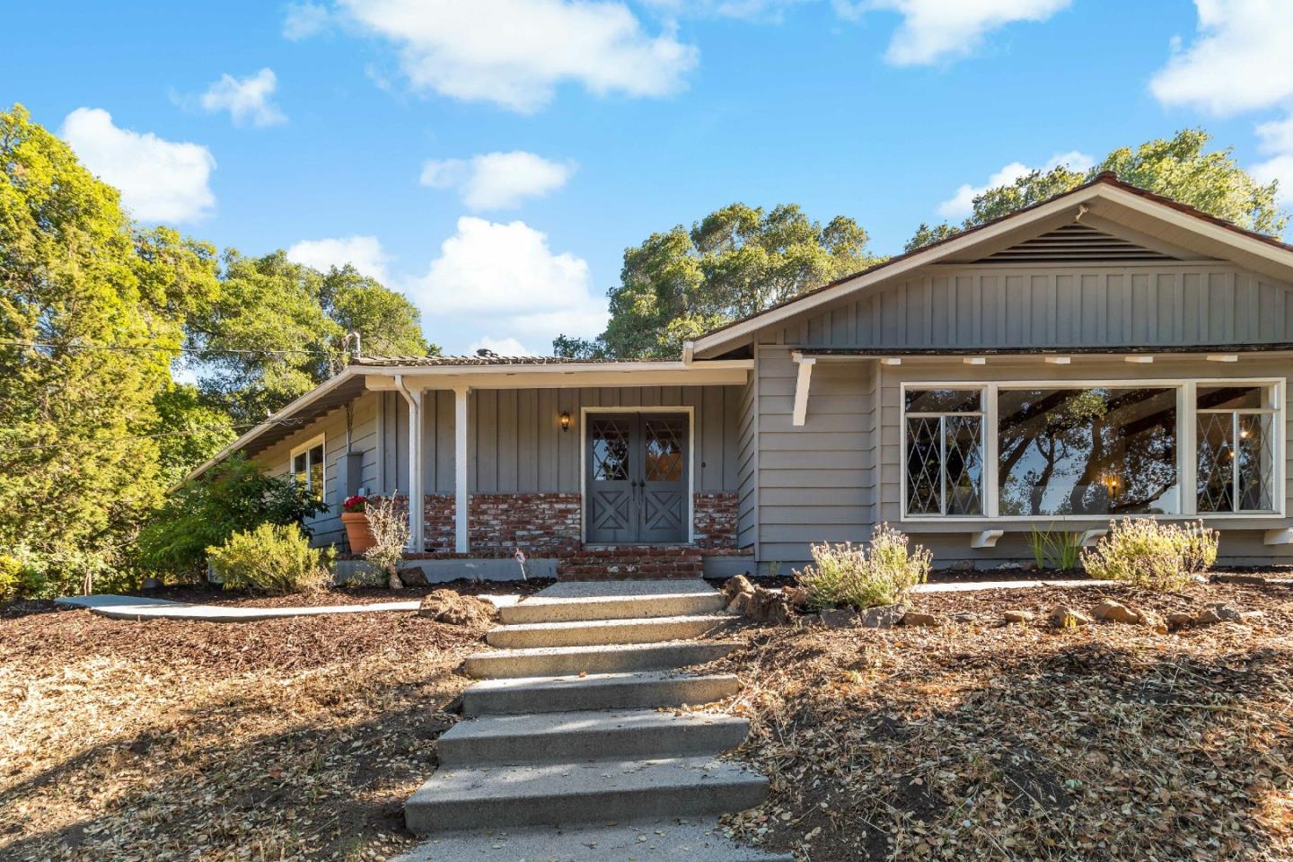 335 Harcross Road Woodside, CA 94062 - Photo 2 of 72 a front view of a house with a yard
