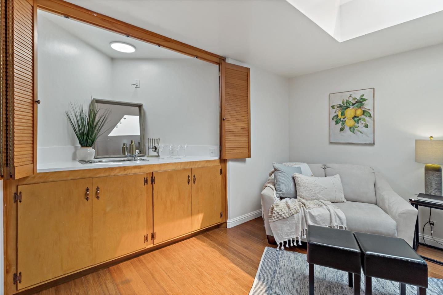 335 Harcross Road Woodside, CA 94062 - Photo 14 of 72 a living room with furniture and wooden floor