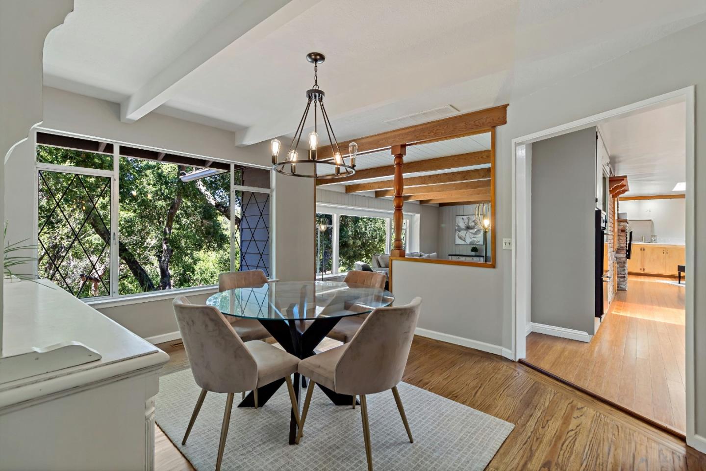 335 Harcross Road Woodside, CA 94062 - Photo 15 of 72 a view of a dining room with furniture window and wooden floor