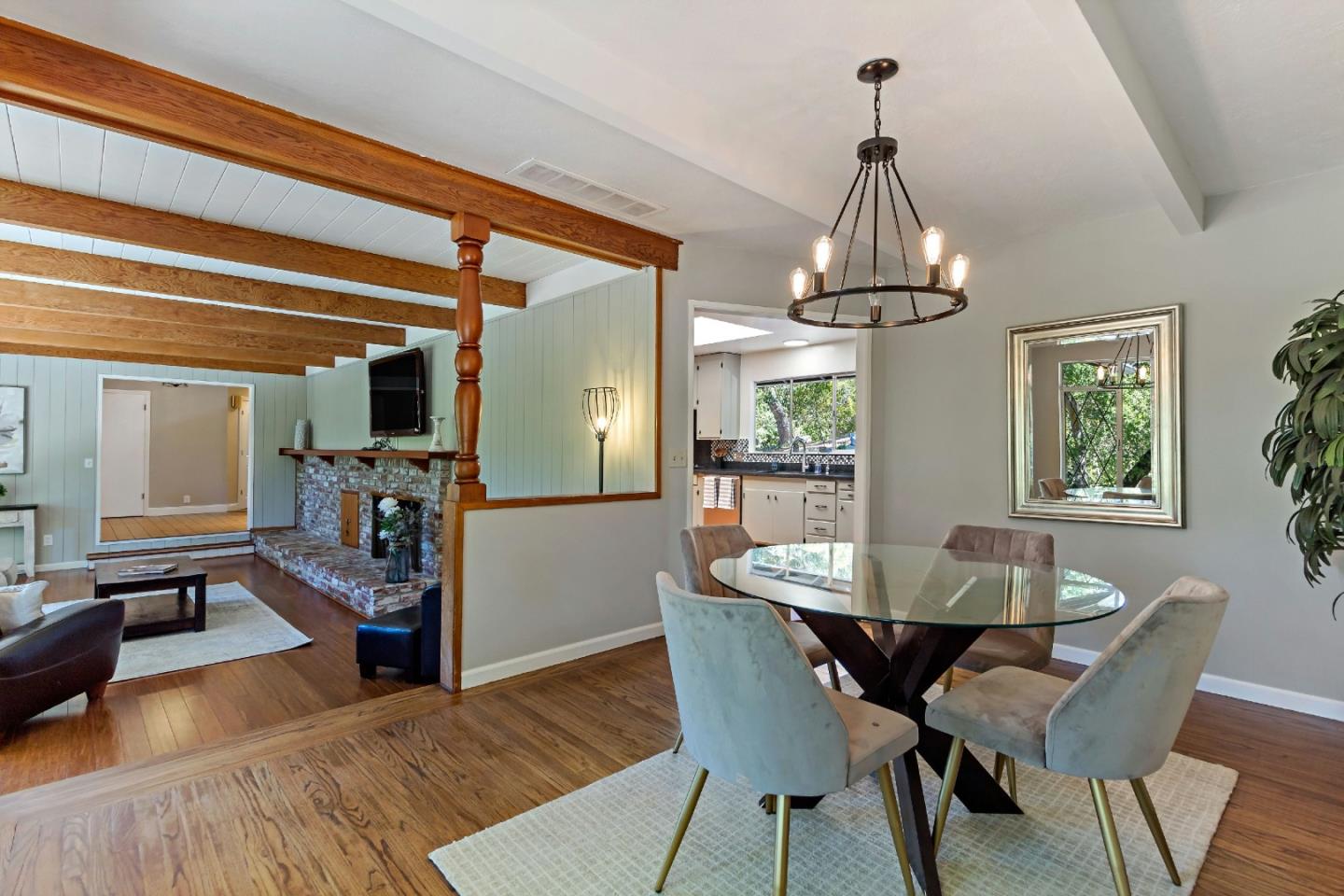 335 Harcross Road Woodside, CA 94062 - Photo 17 of 72 a dining room with furniture a chandelier and wooden floor