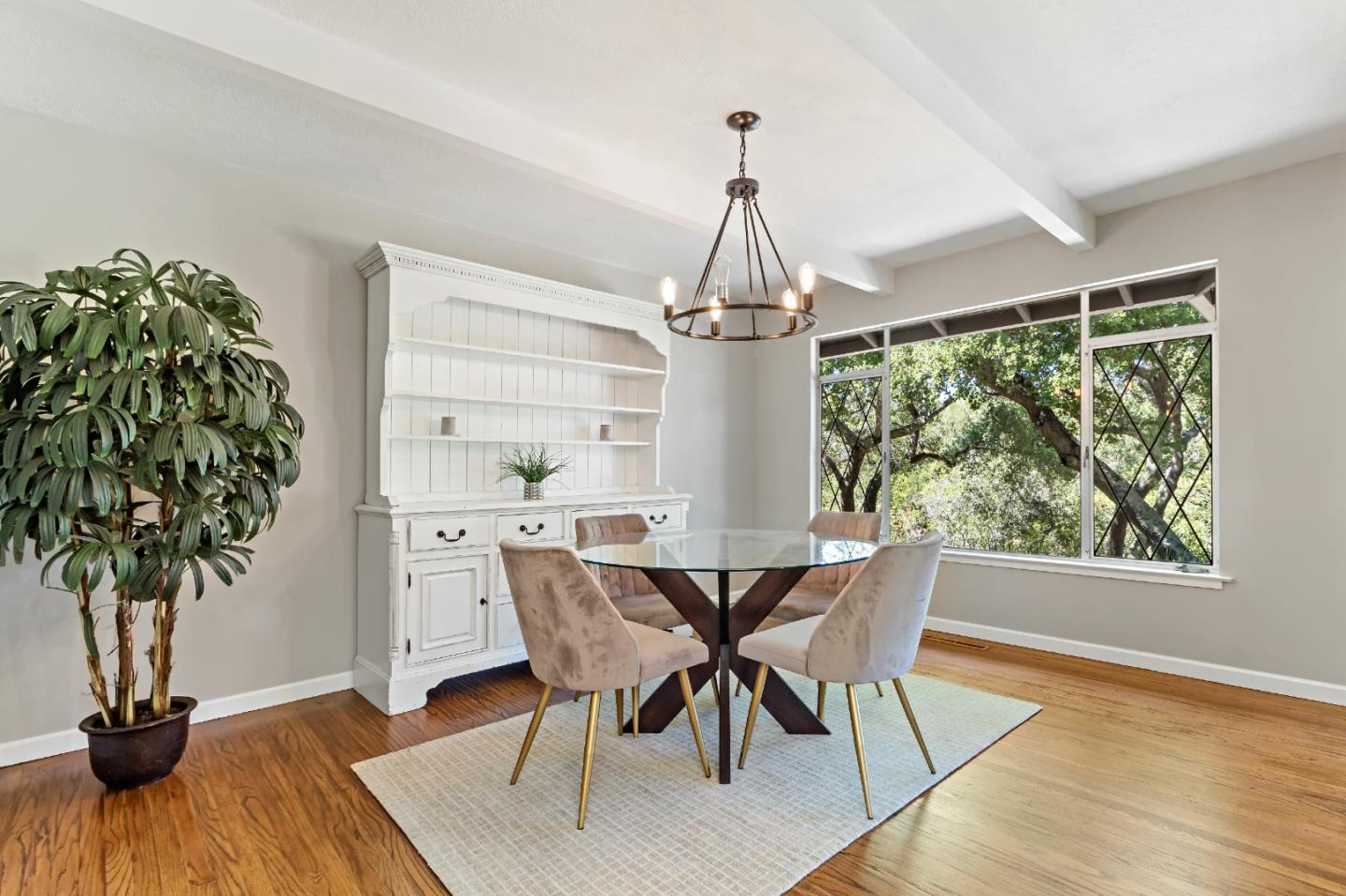 335 Harcross Road Woodside, CA 94062 - Photo 18 of 72 a view of a dining room with furniture window and wooden floor