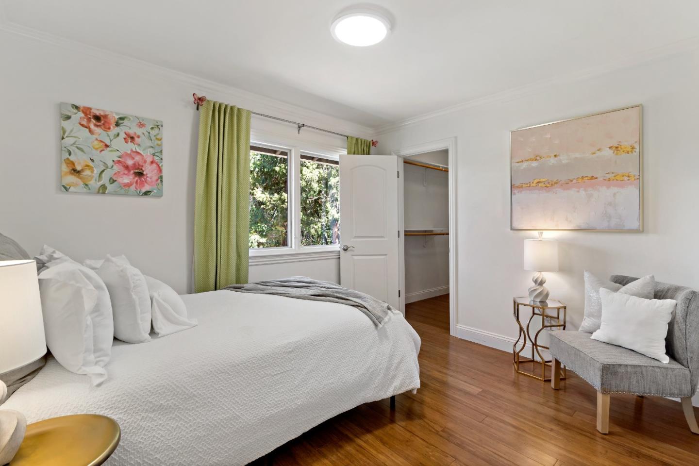 335 Harcross Road Woodside, CA 94062 - Photo 36 of 72 a bedroom with a bed and painting on the wall