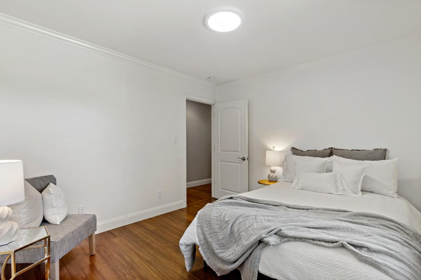 335 Harcross Road Woodside, CA 94062 - Photo 37 of 72 a bedroom with a bed and wooden floor