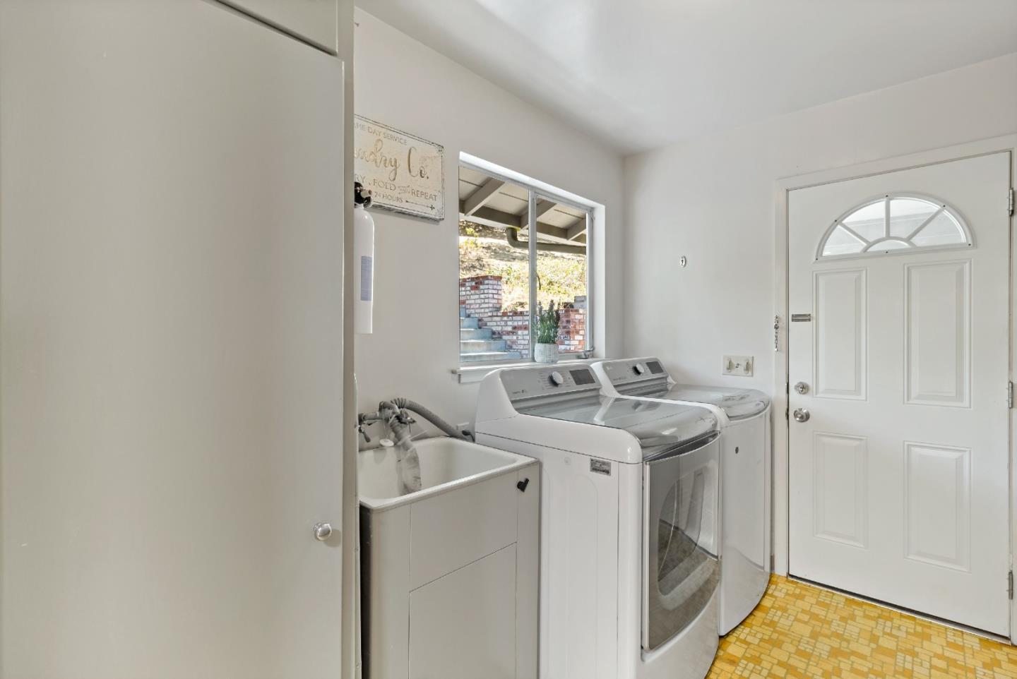 335 Harcross Road Woodside, CA 94062 - Photo 39 of 72 a bathroom with a sink and a window