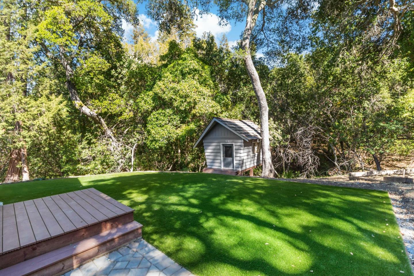 335 Harcross Road Woodside, CA 94062 - Photo 48 of 72 a view of a wooden chairs in backyard of the house