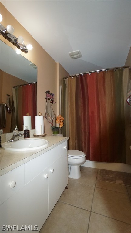 3115 Meadow Road Lehigh Acres, FL 33974 - Photo 12 of 23 a bathroom with a toilet sink and mirror