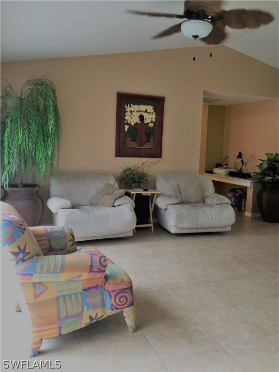 3115 Meadow Road Lehigh Acres, FL 33974 - Photo 9 of 23 a living room with furniture and a potted plant