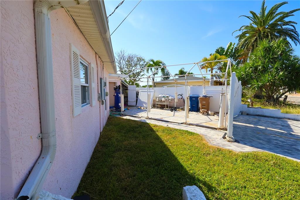 365 145th Avenue Madeira Beach, FL 33708 - Photo 13 of 16 a view of a house with a yard
