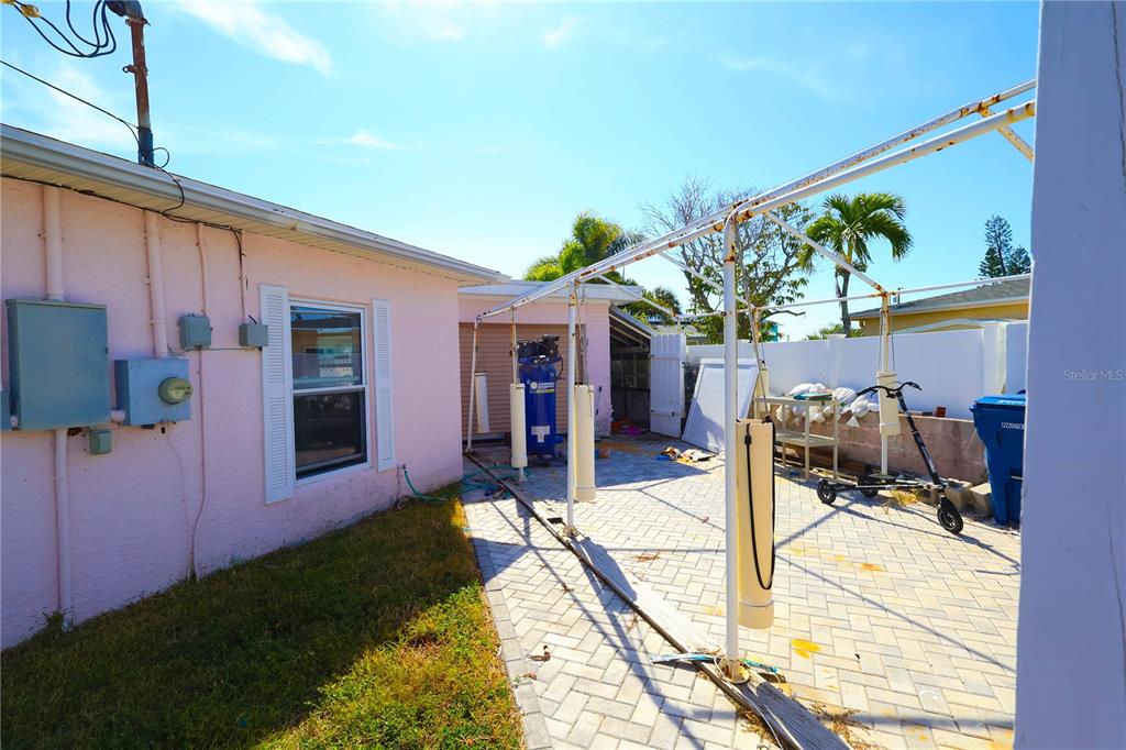 365 145th Avenue Madeira Beach, FL 33708 - Photo 14 of 16 a view of a house with backyard and sitting area
