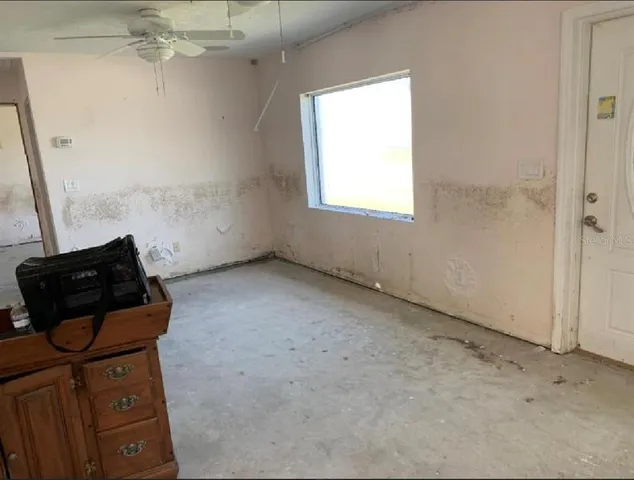 an empty room with windows