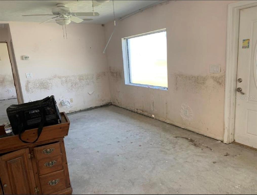 365 145th Avenue Madeira Beach, FL 33708 - Photo 3 of 16 an empty room with windows