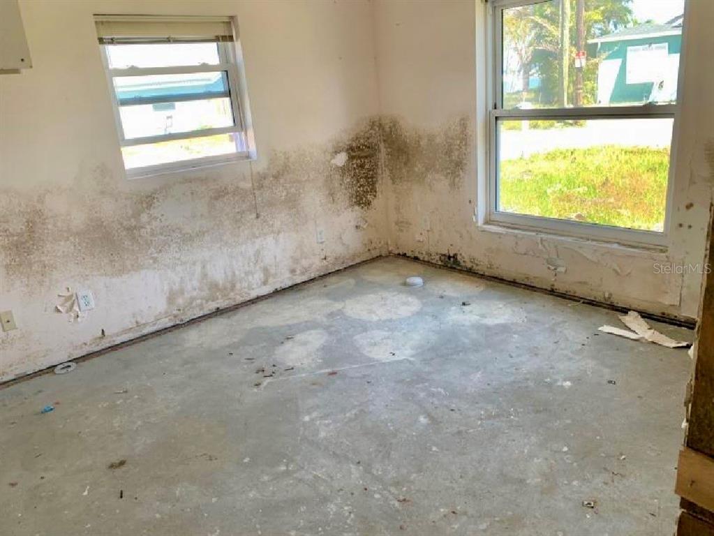 365 145th Avenue Madeira Beach, FL 33708 - Photo 7 of 16 an empty room with a window