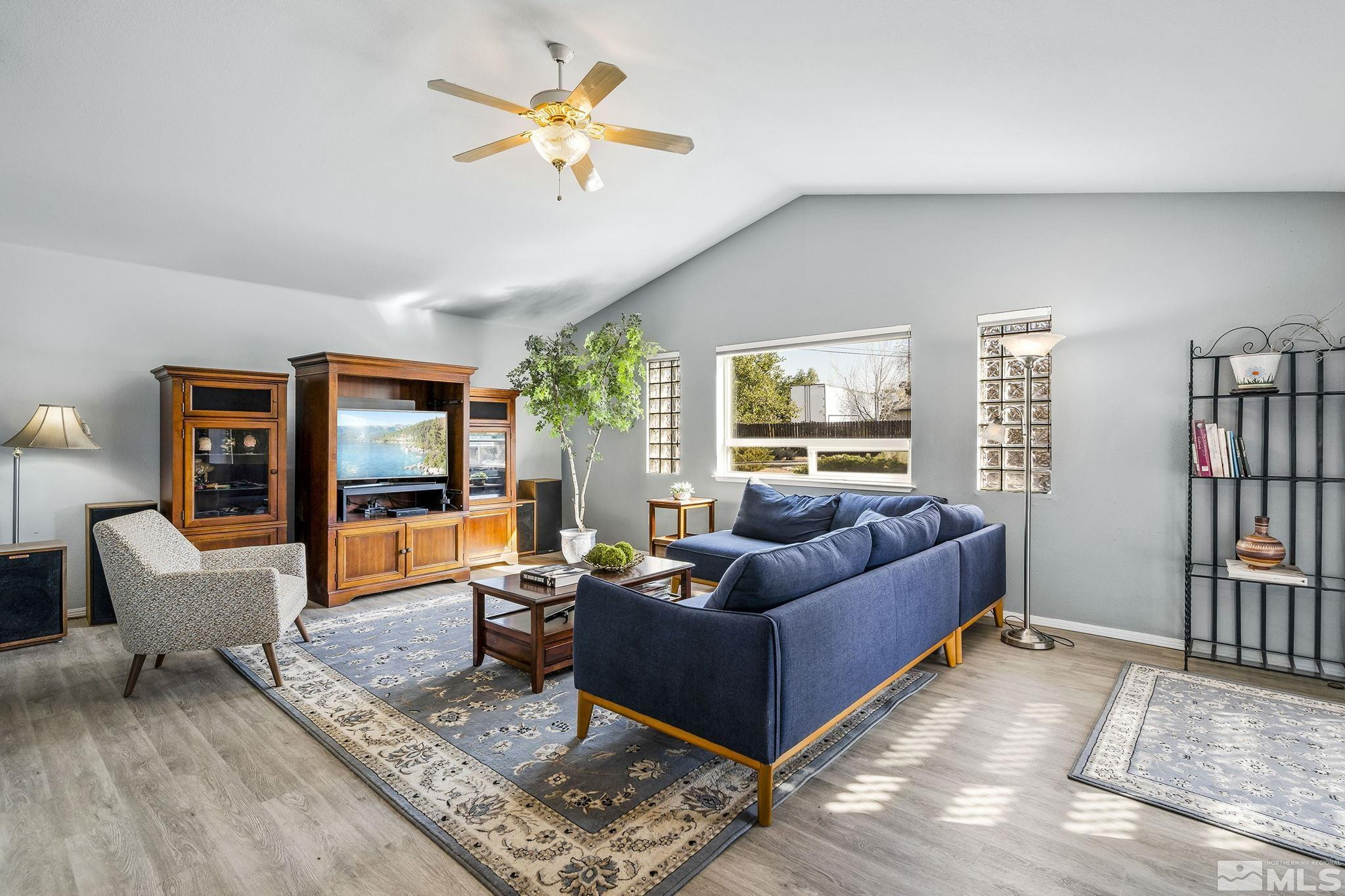 1090 Lavender Way Reno, NV 89521 - Photo 12 of 22 a living room with furniture and a book shelf