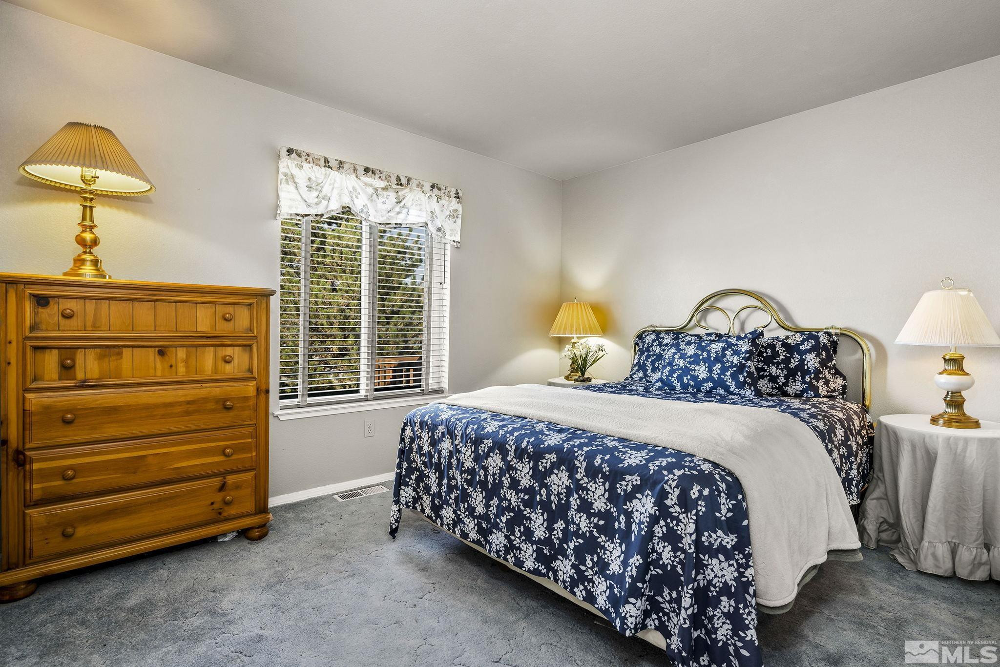 1090 Lavender Way Reno, NV 89521 - Photo 16 of 22 a bedroom with a bed and a window