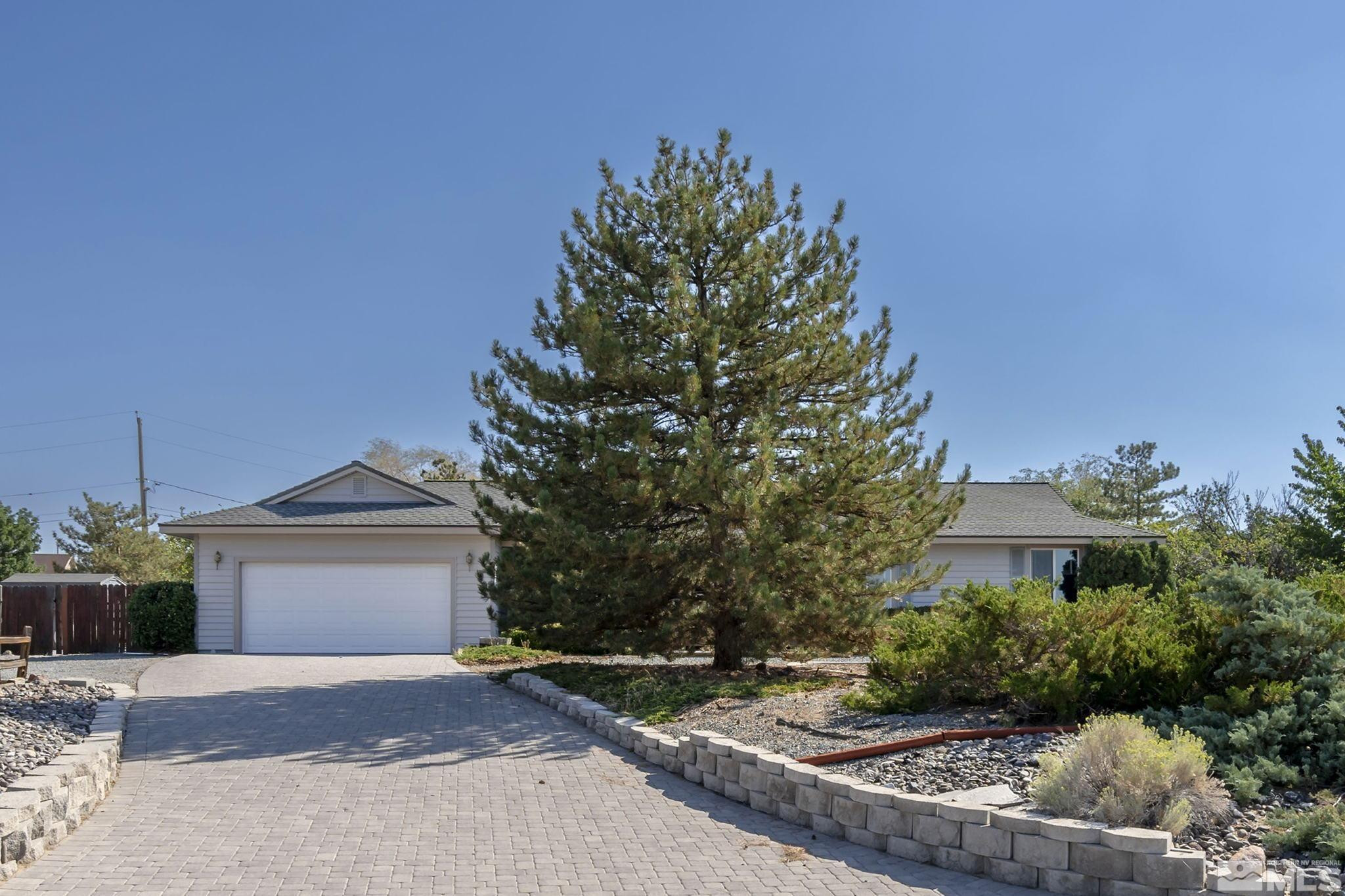 1090 Lavender Way Reno, NV 89521 - Photo 2 of 22 a view of a house with a tree and a yard