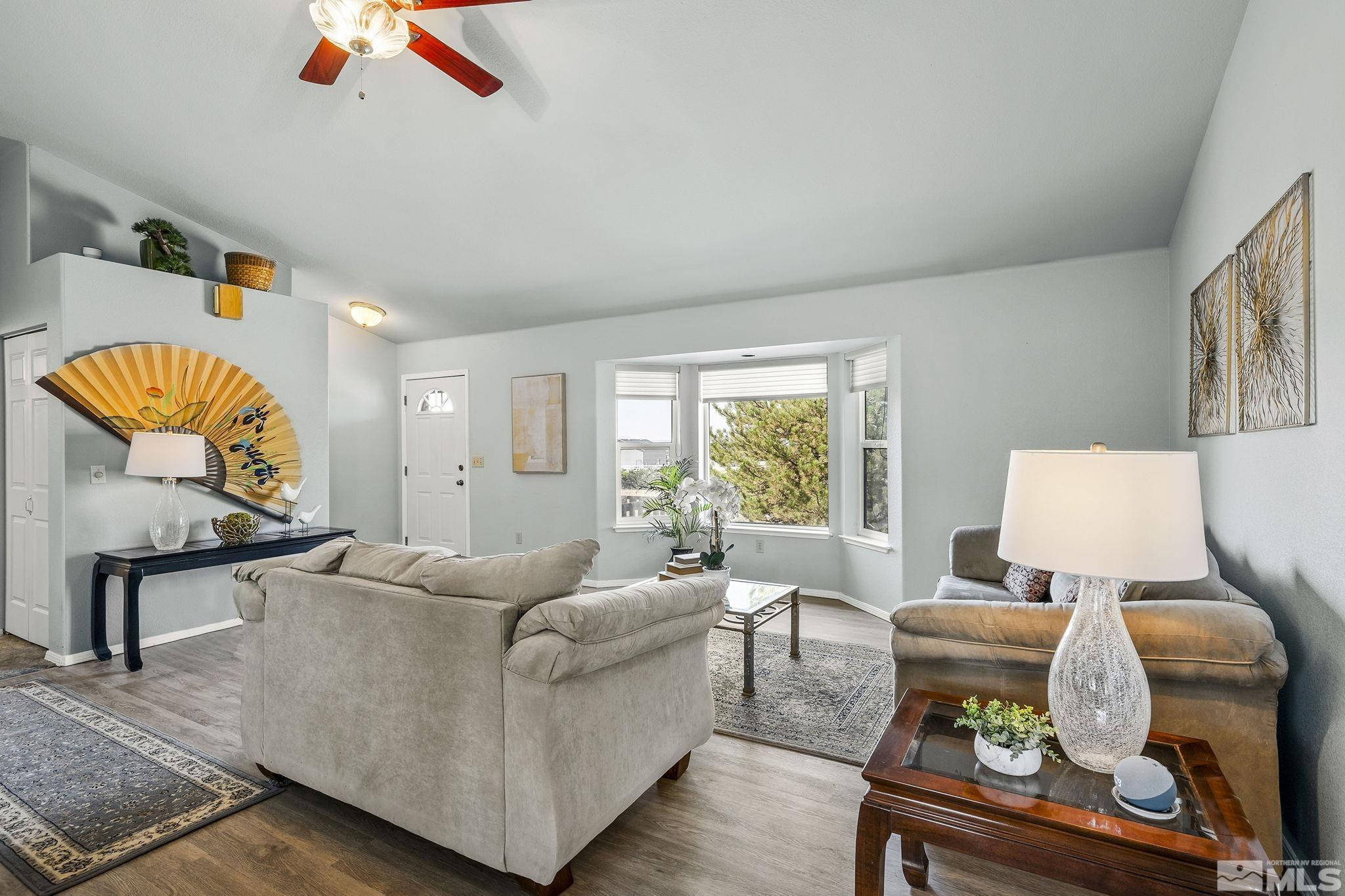 1090 Lavender Way Reno, NV 89521 - Photo 5 of 22 a living room with furniture and a table