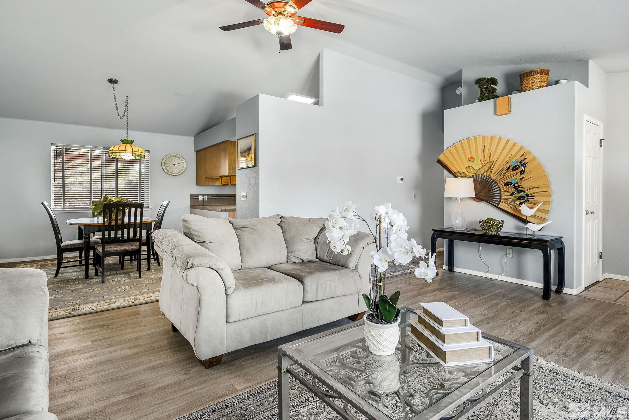 1090 Lavender Way Reno, NV 89521 - Photo 6 of 22 a living room with furniture and a wooden floor