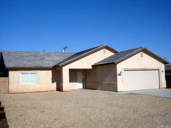 a view of garage and yard