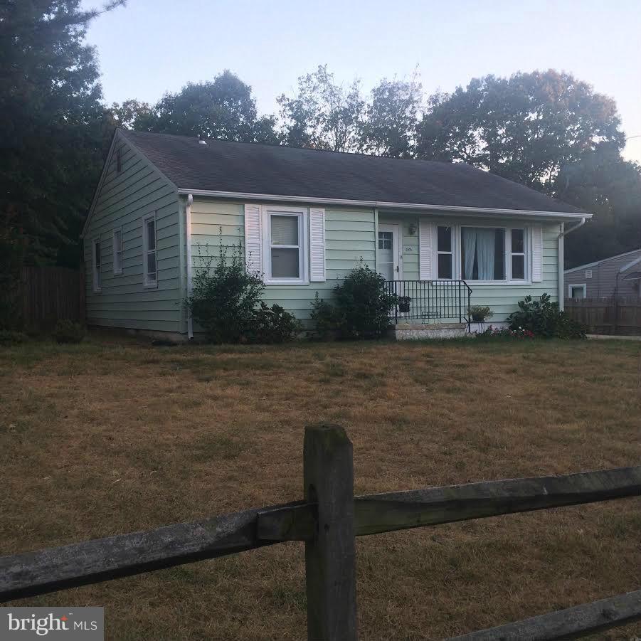 6505 Woodley Road Clinton, MD 20735 - Photo 1 of 12 a front view of house with yard and trees