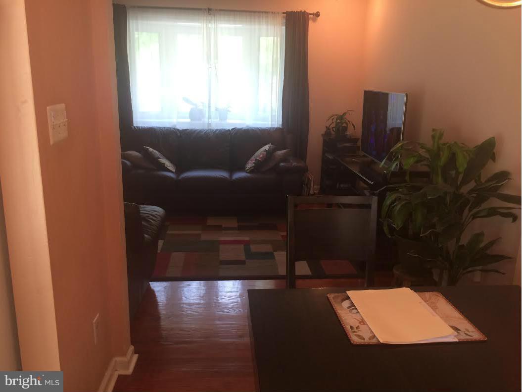 6505 Woodley Road Clinton, MD 20735 - Photo 2 of 12 a living room with furniture and a potted plant
