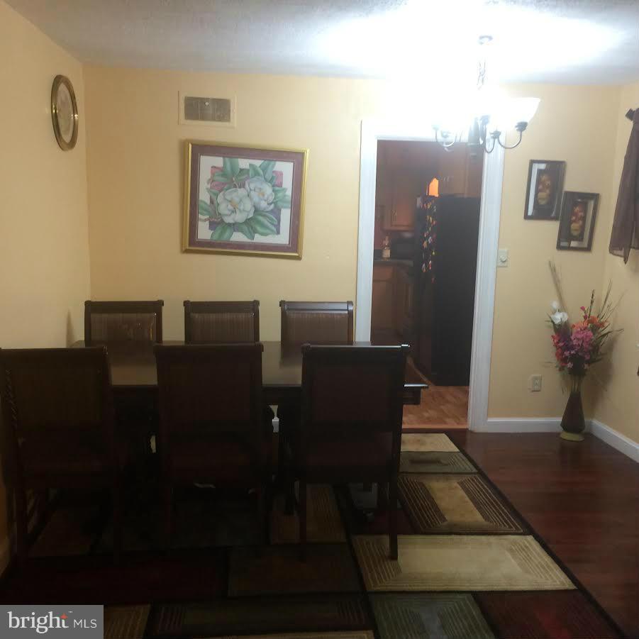 6505 Woodley Road Clinton, MD 20735 - Photo 11 of 12 a view of a livingroom with furniture and a potted plant