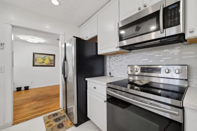 a utility room with sink dryer and washer