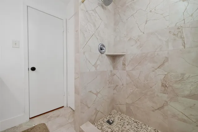 a bathroom with a sink vanity and toilet