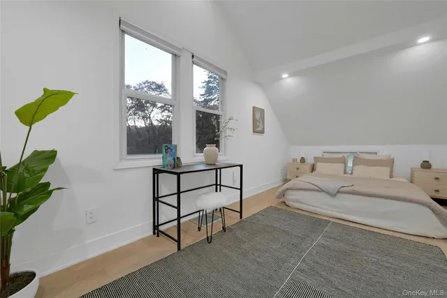 a bedroom with a bed and a table in it