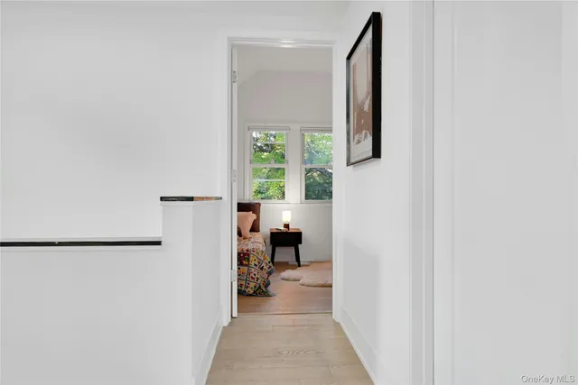 a living room with furniture and a painting