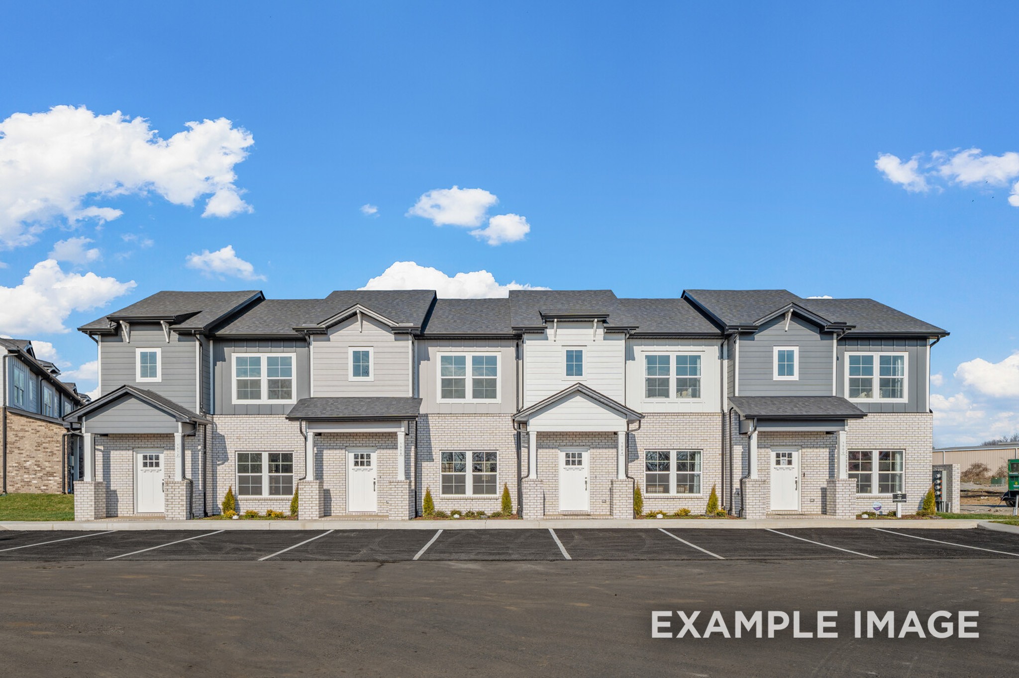 1725 Elliott Williams Way Gallatin, TN 37066 - Photo 2 of 22 a front view of a house with a yard