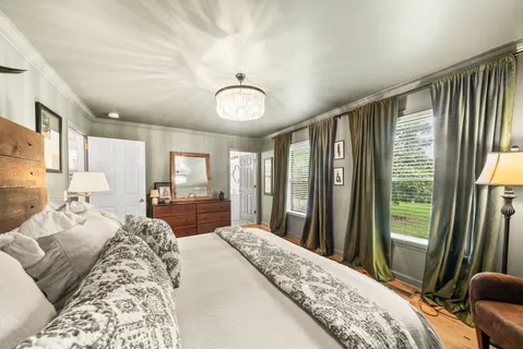 a bedroom with a bed and a view of bathroom