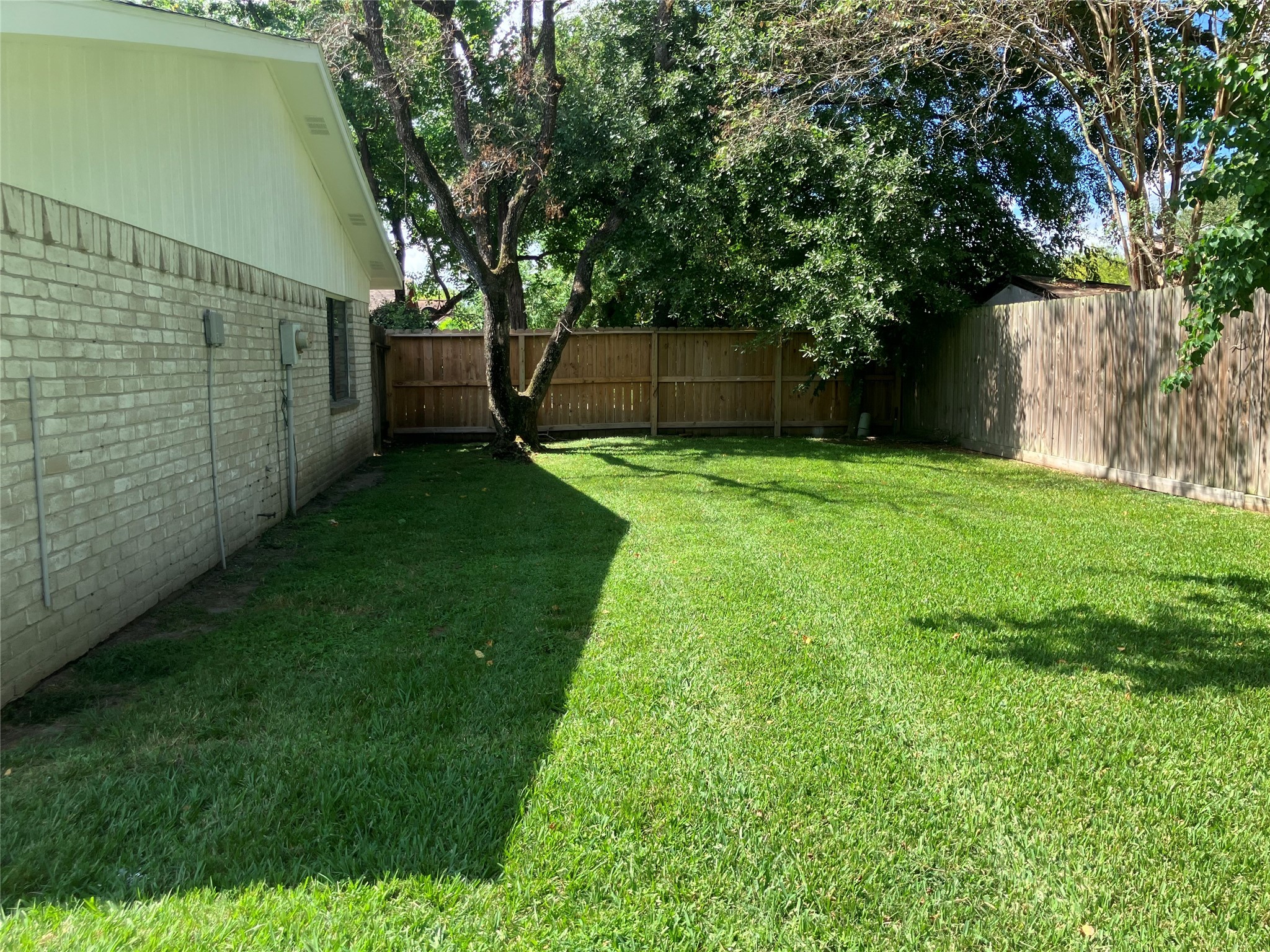 4030 Lost Oak Drive Spring, TX 77388 - Photo 16 of 17 a view of a backyard with large tree