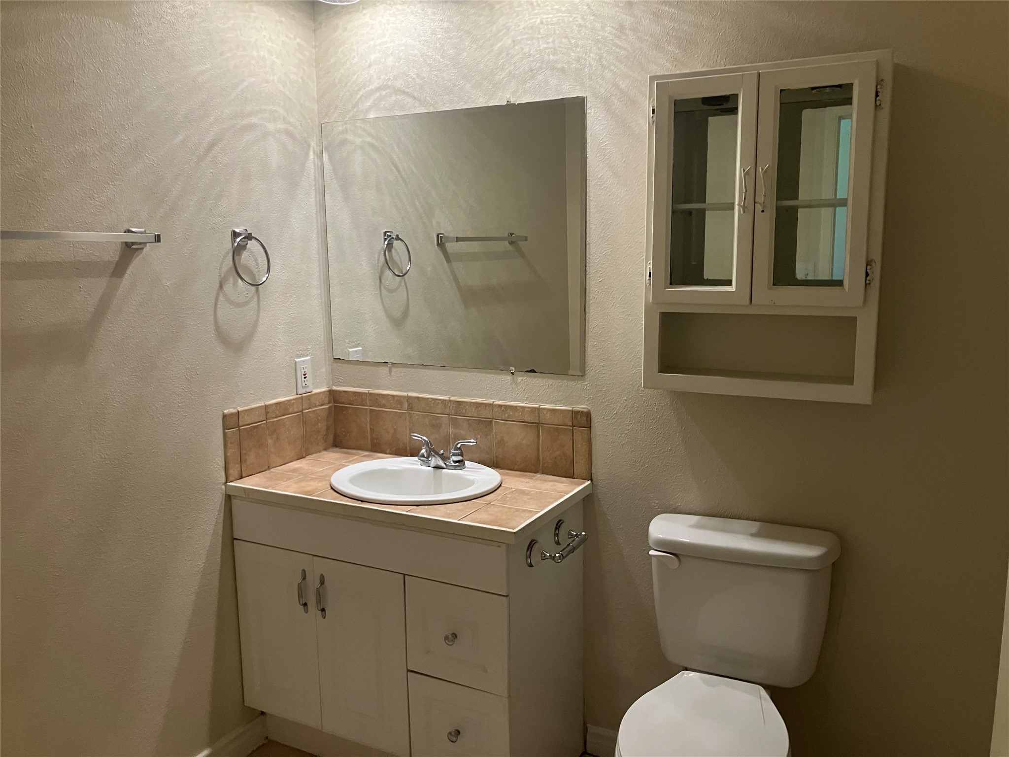4030 Lost Oak Drive Spring, TX 77388 - Photo 9 of 17 a bathroom with a toilet sink and mirror