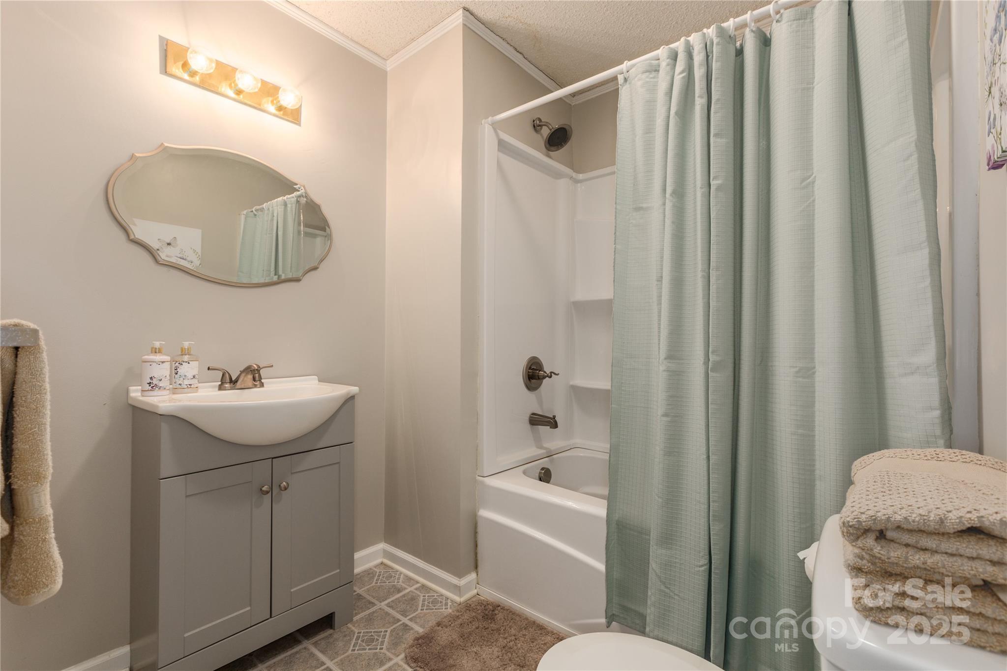 72 Cooper Drive Nebo, NC 28761 - Photo 16 of 18 a bathroom with a sink toilet and shower