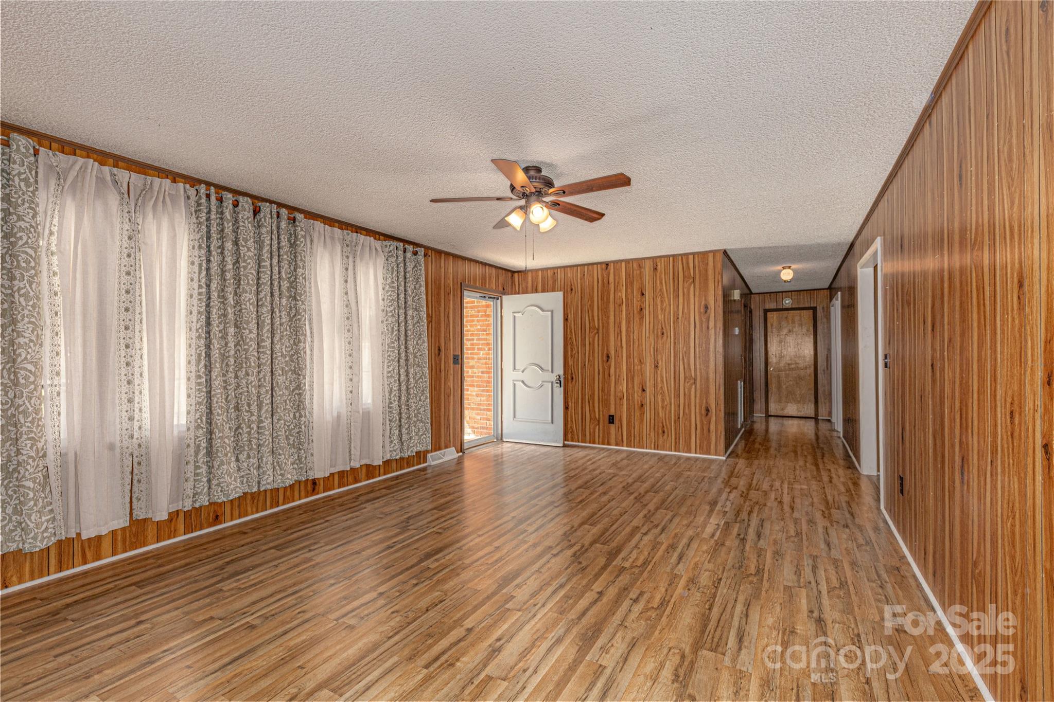 72 Cooper Drive Nebo, NC 28761 - Photo 8 of 18 wooden floor in an empty room with a window