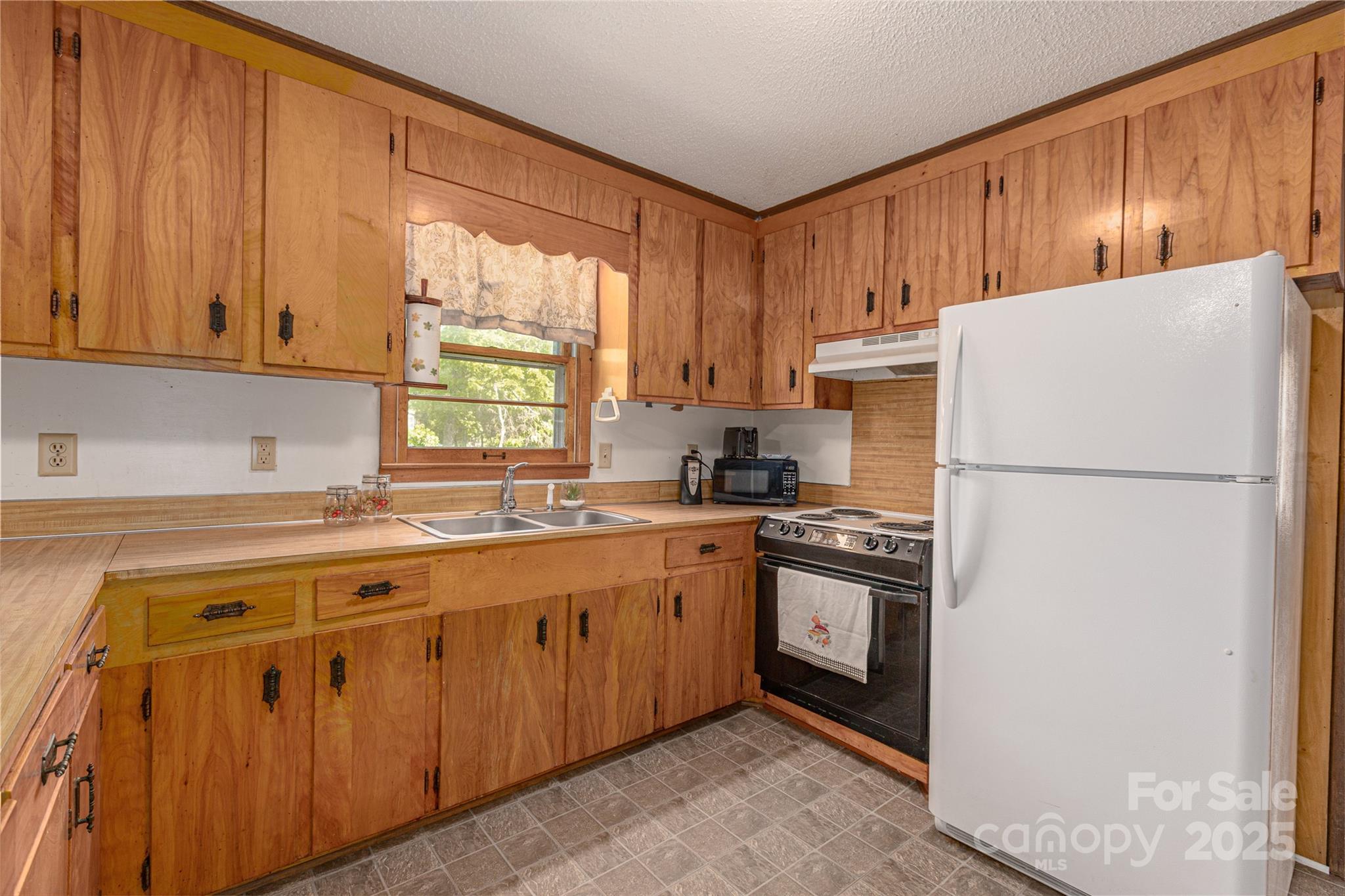 72 Cooper Drive Nebo, NC 28761 - Photo 10 of 18 a kitchen with stainless steel appliances granite countertop a refrigerator a stove a sink and a microwave