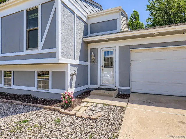 a view of a house with entrance gate