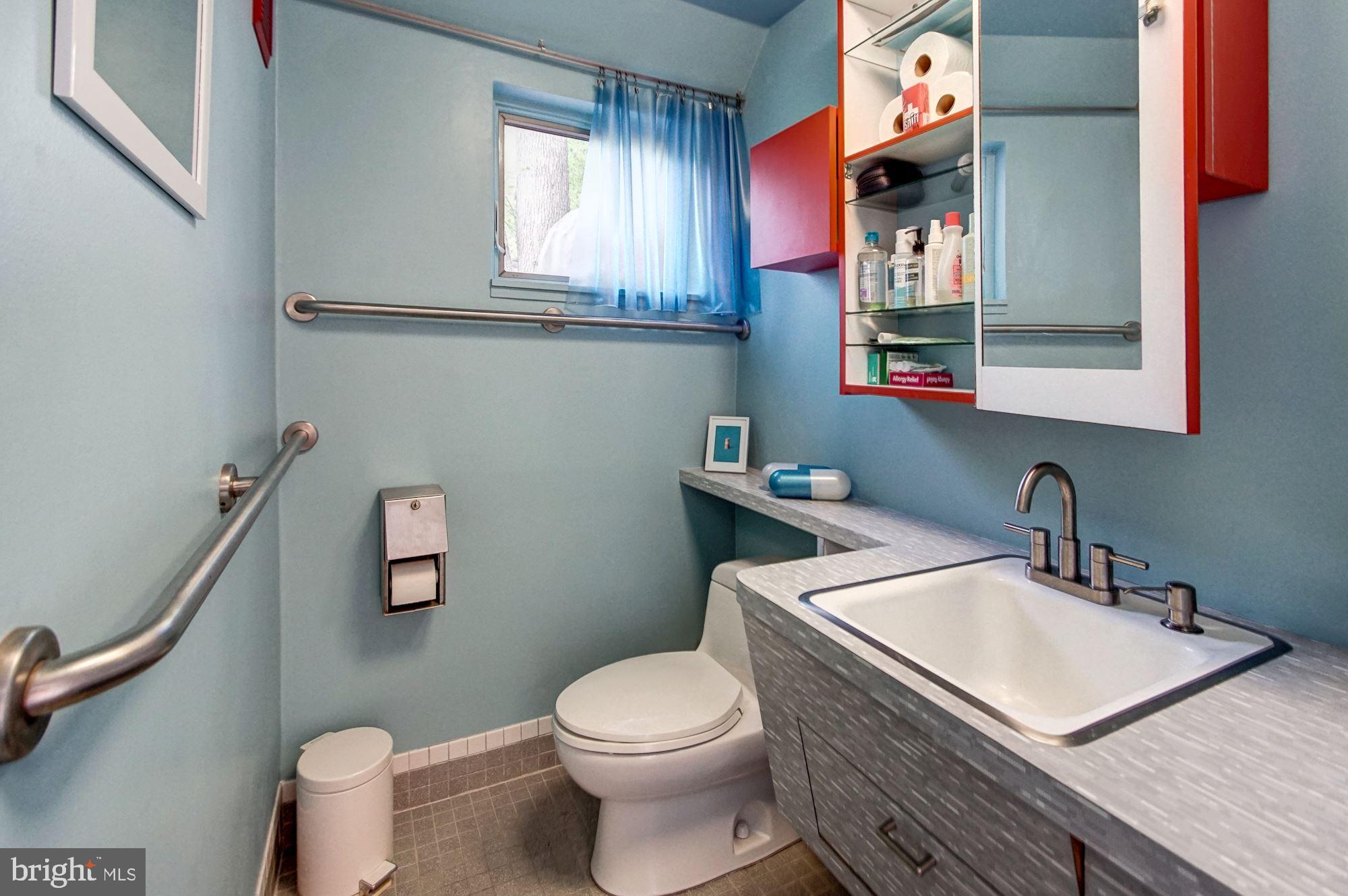 2148 Cedar Road Port Republic, MD 20676 - Photo 31 of 55 a bathroom with a toilet sink and mirror