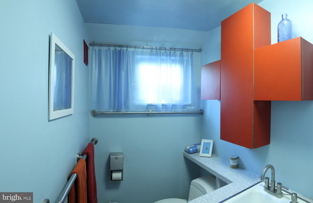 2148 Cedar Road Port Republic, MD 20676 - Photo 32 of 55 a bathroom with a sink and a mirror