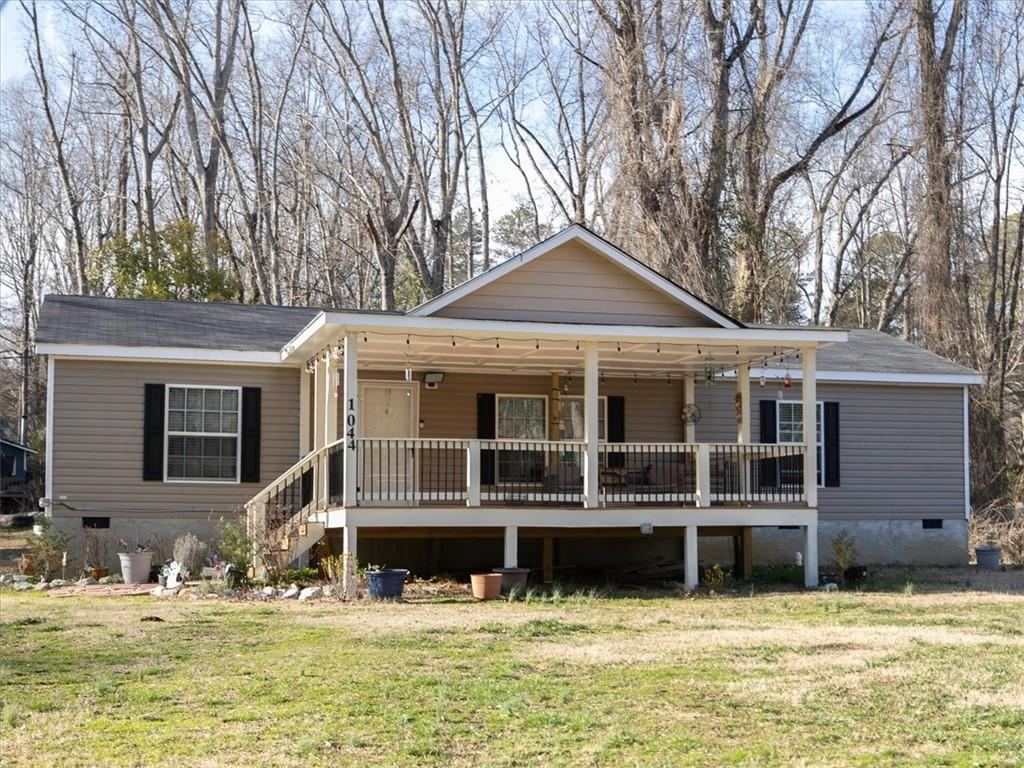1044 Waterworks Road Commerce, GA 30529 - Photo 1 of 1 a view of a house with a swimming pool