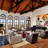 a living room with furniture a rug and a window