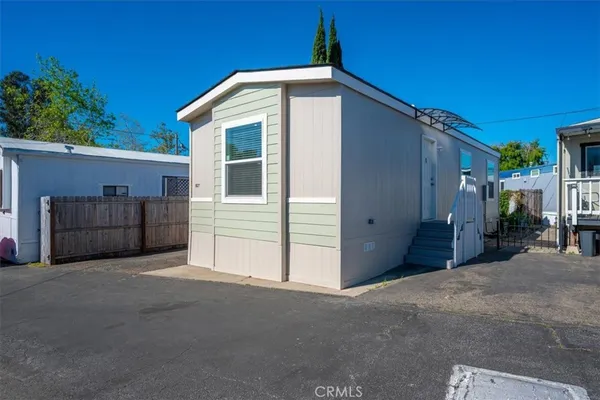 a view of an house with backyard and garage