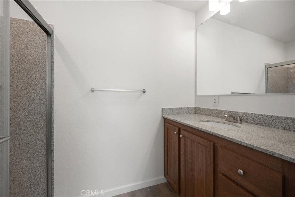 1255 Orcutt Road, Unit B27 San Luis Obispo, CA 93401 - Photo 17 of 24 a bathroom with a granite countertop sink and mirror