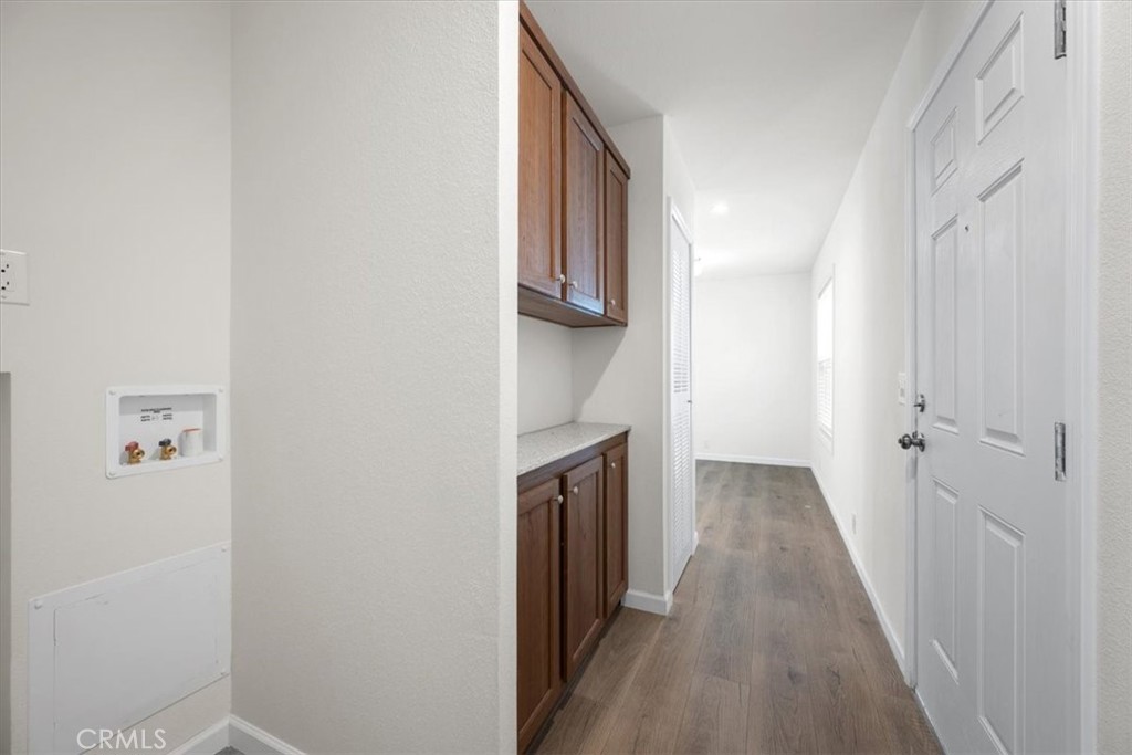 1255 Orcutt Road, Unit B27 San Luis Obispo, CA 93401 - Photo 18 of 24 a view of a hallway with wooden floor and staircase