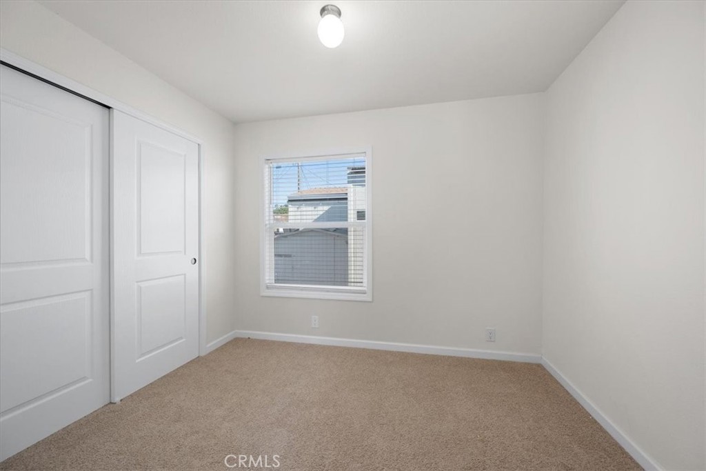 1255 Orcutt Road, Unit B27 San Luis Obispo, CA 93401 - Photo 20 of 24 an empty room with a empty space and windows