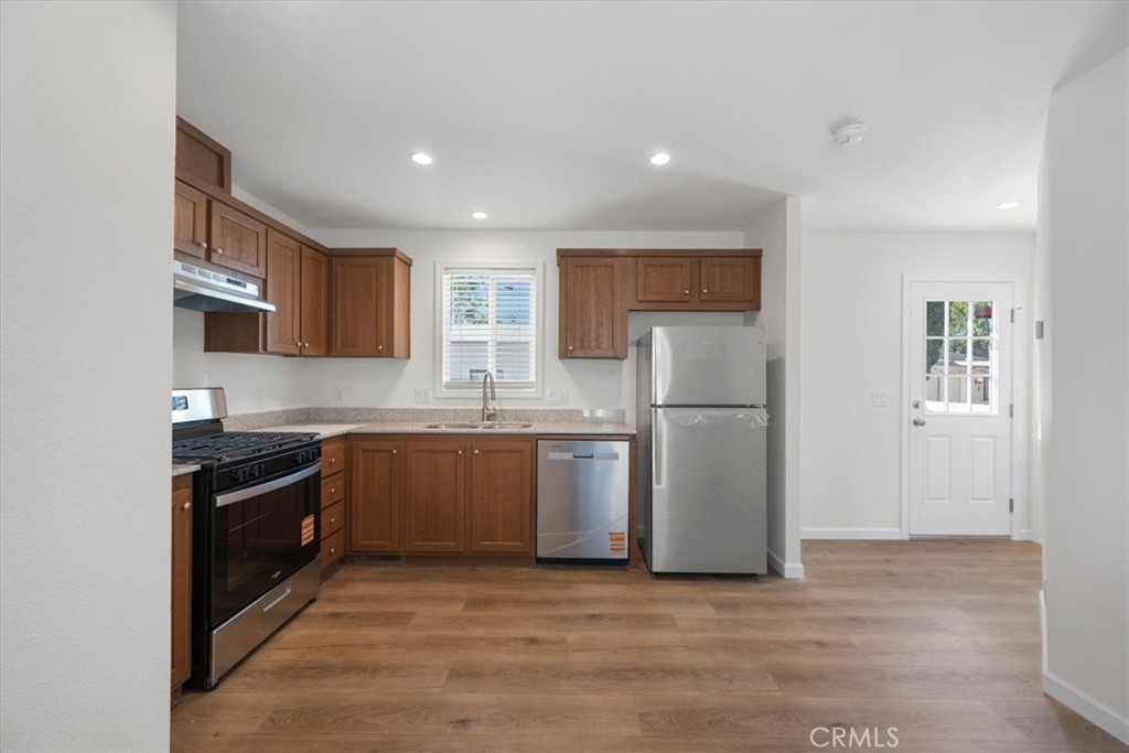1255 Orcutt Road, Unit B27 San Luis Obispo, CA 93401 - Photo 10 of 24 a kitchen with a refrigerator and a sink